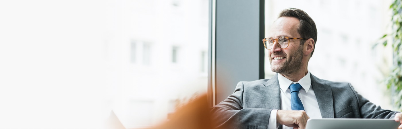 Office worker looking out of window