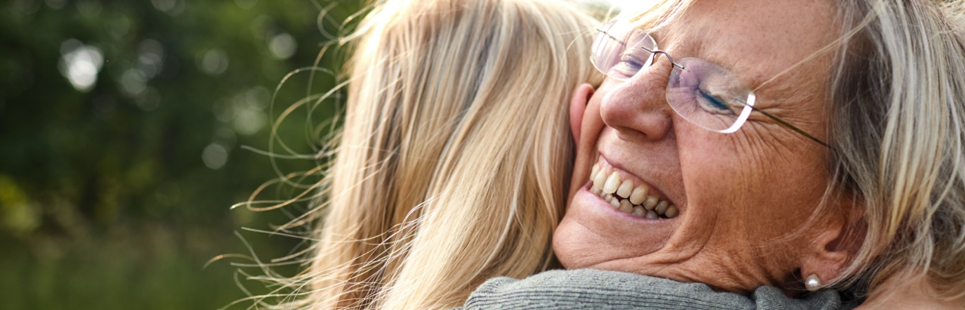 Grandmother hugging granddaughter